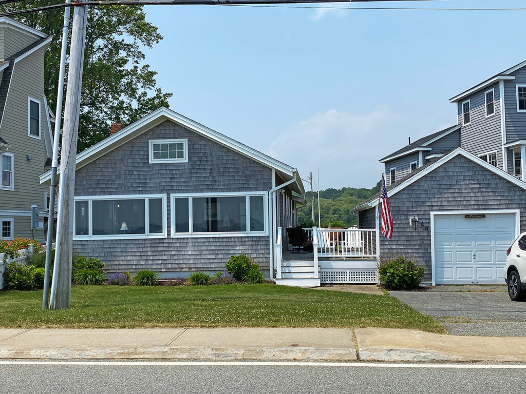 This 3 bedroom, 2 bath Groton Long Point summer rental features an open floor plan, outdoor living space with outdoor shower and water views.